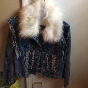 A fur trimmed ..ripped jean jacket